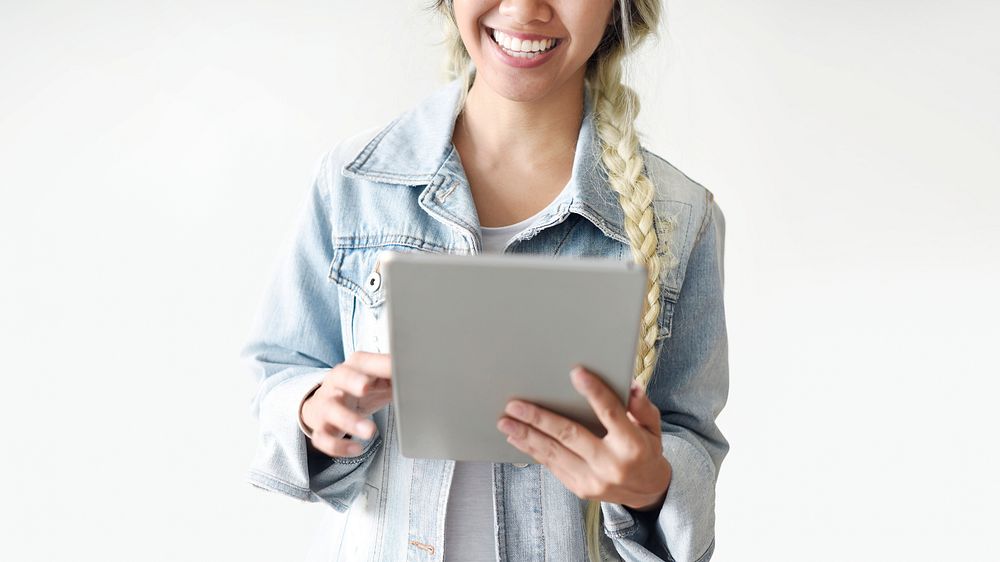 Blonde asian girl with a tablet