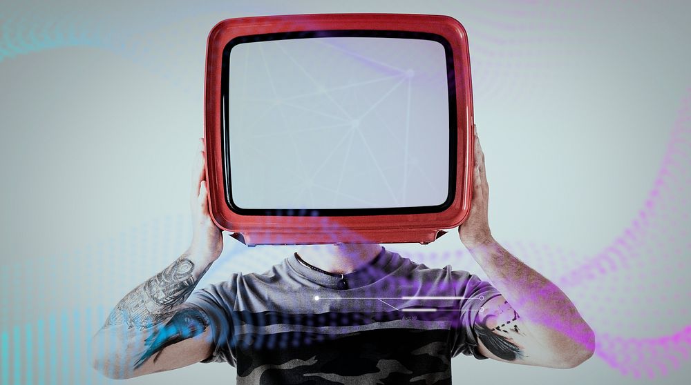 Tattooed man holding a television