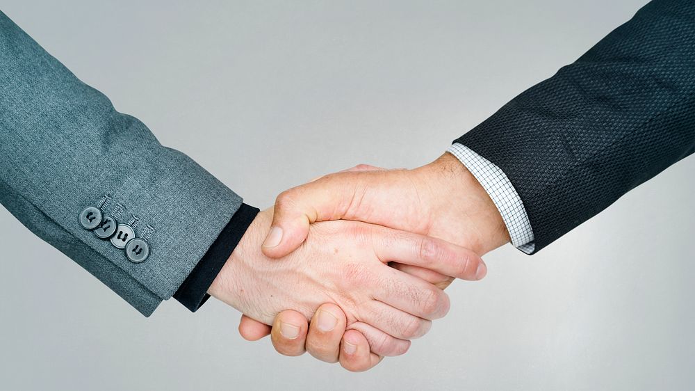 Business people shaking hands for a deal