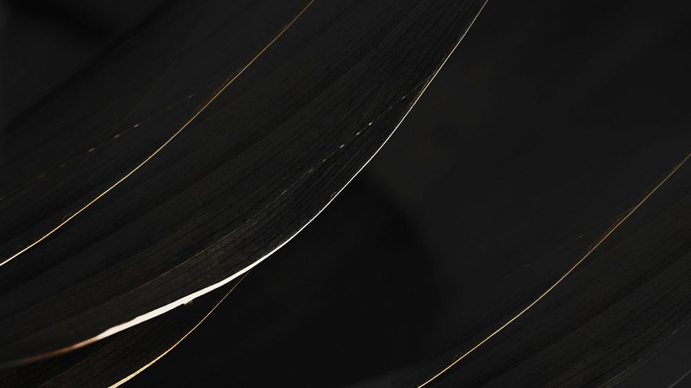 White and golden streaks on a black background