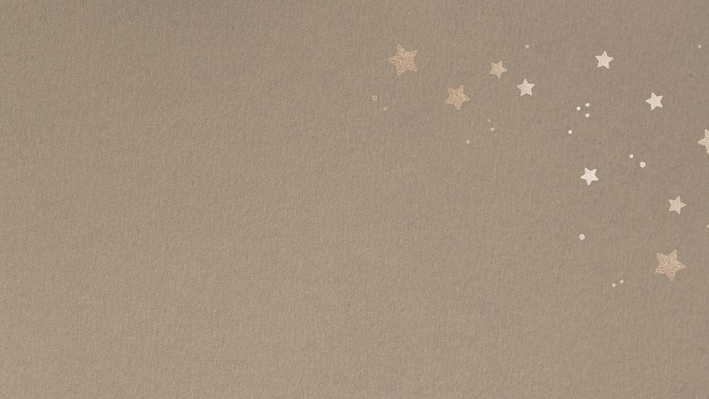 Shimmering gold stars on a beige background 