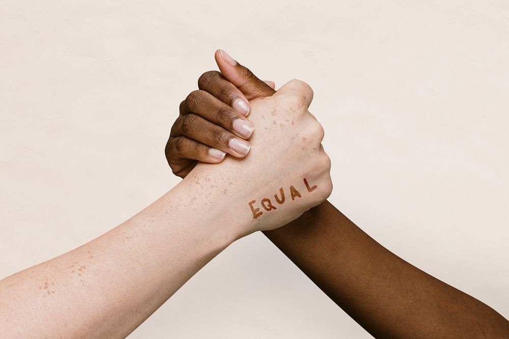 Equal word on two hands joining together background