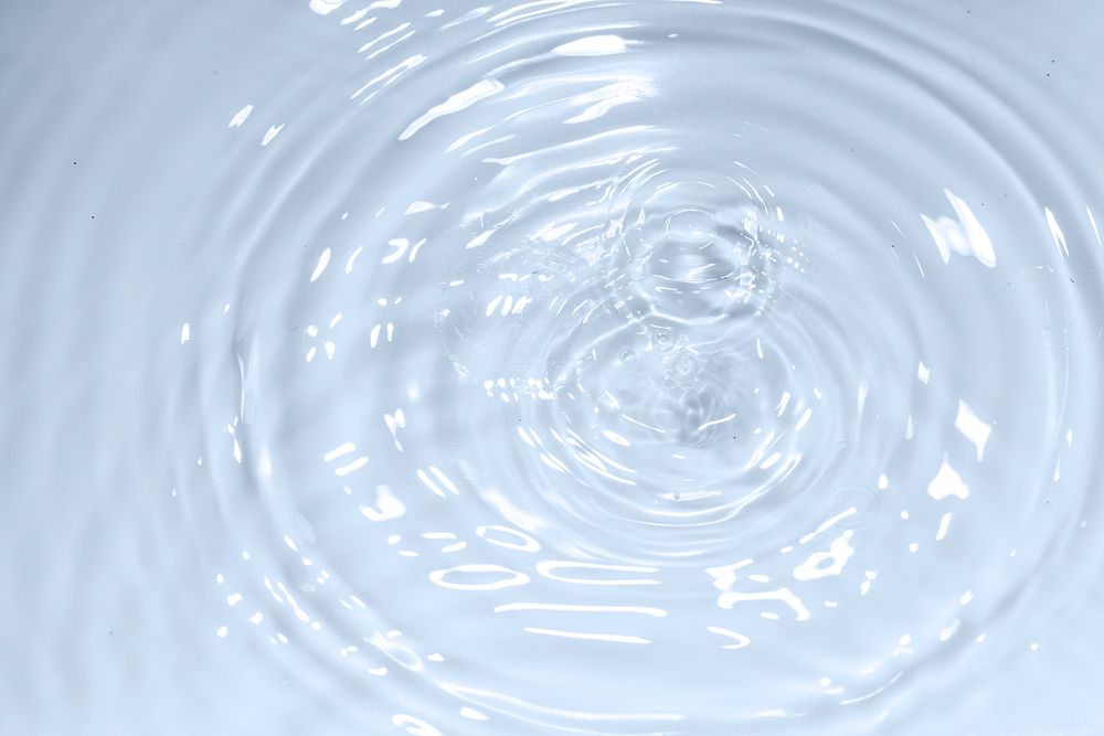 Water drop on clear water wave circle pattern background