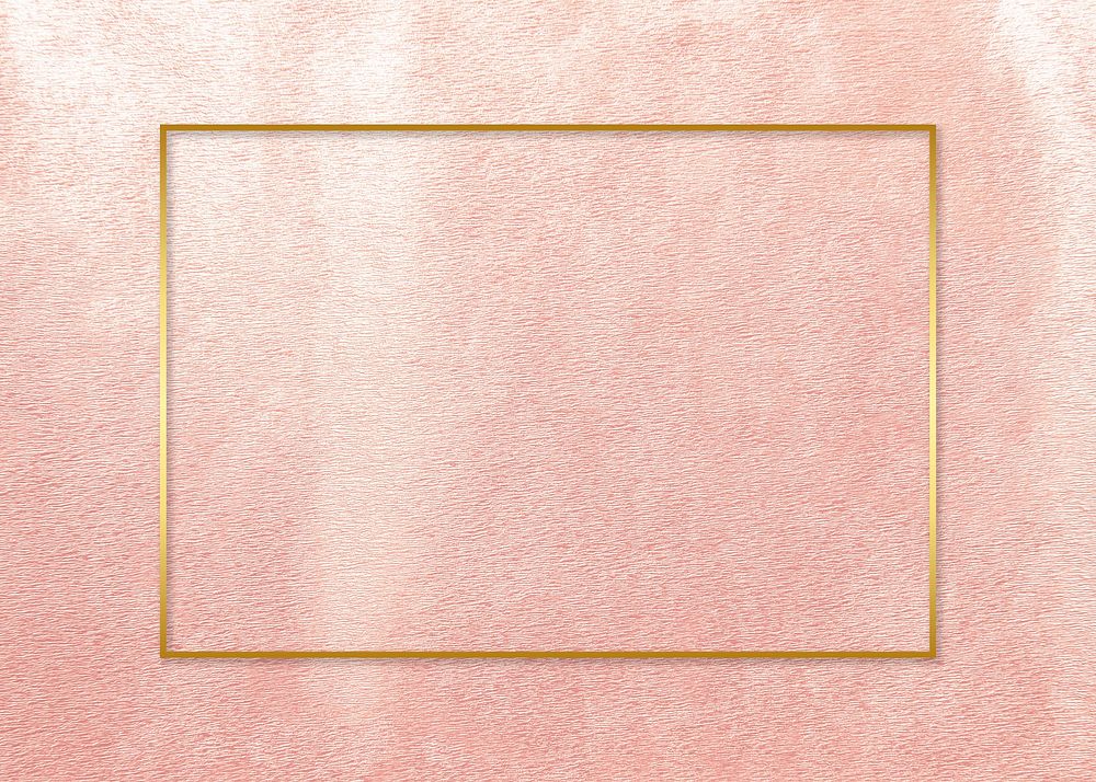Golden frame on a pink concrete wall