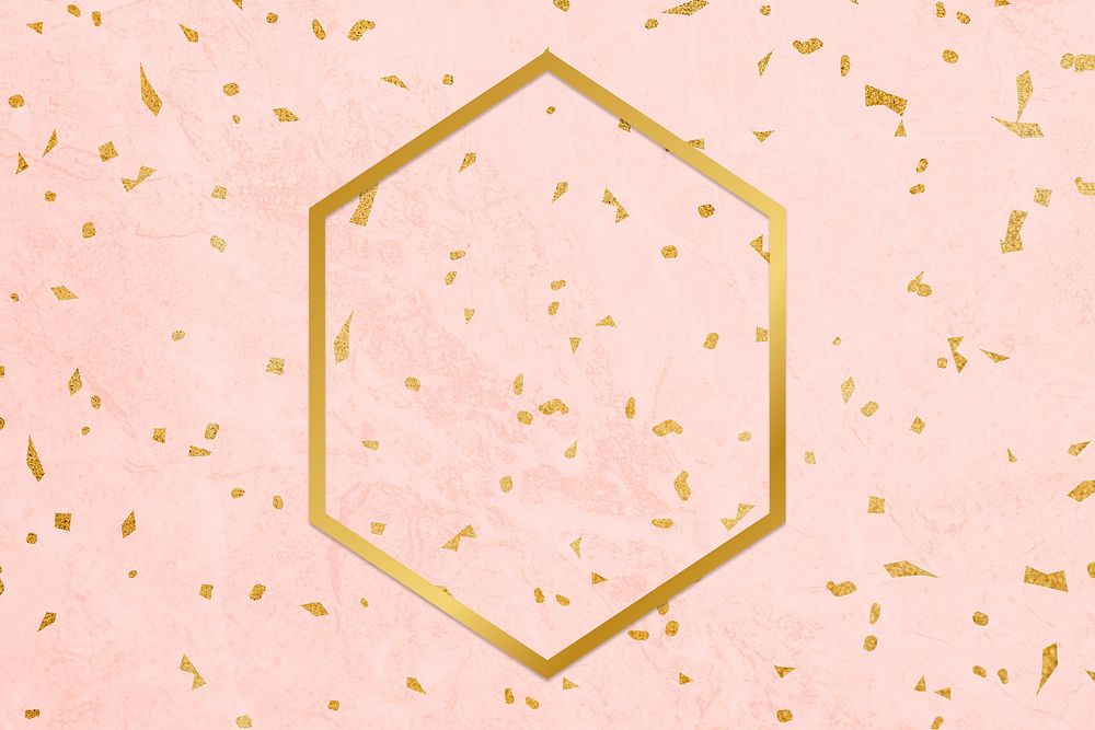 Golden framed hexagon on a pink texture
