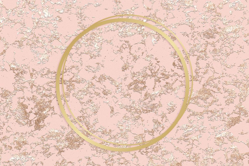 Gold round frame on a rough rose gold background