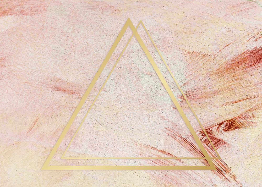 Gold triangle frame on a pink paintbrush stroke patterned background