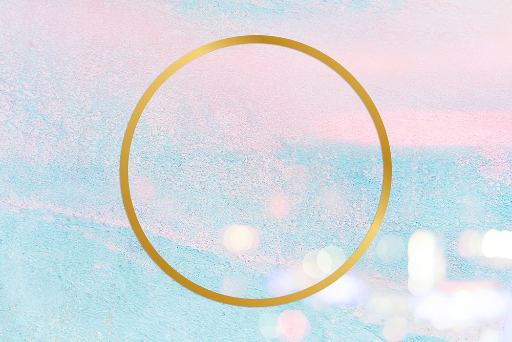 Gold round frame on a pastel pink and blue concrete textured background