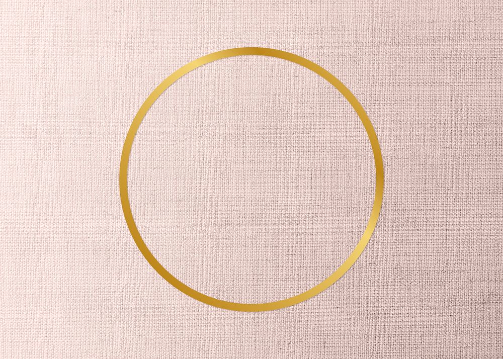 Gold round frame on a peach fabric background