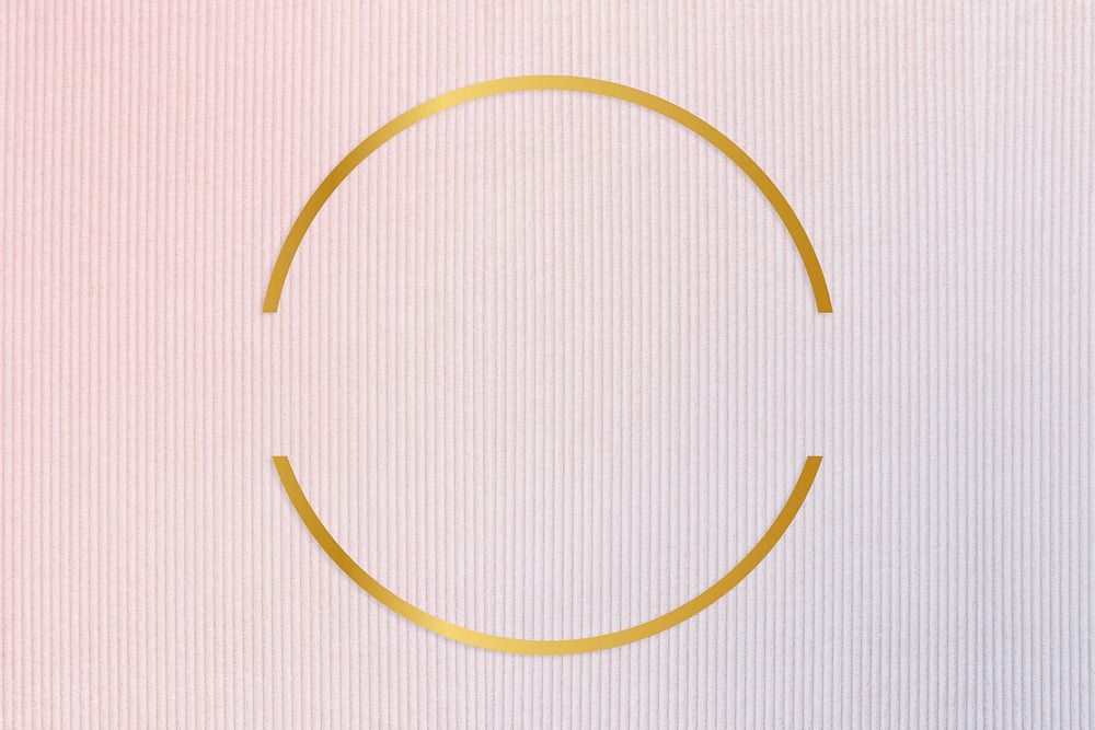 Gold round frame on a pinkish blue fabric background
