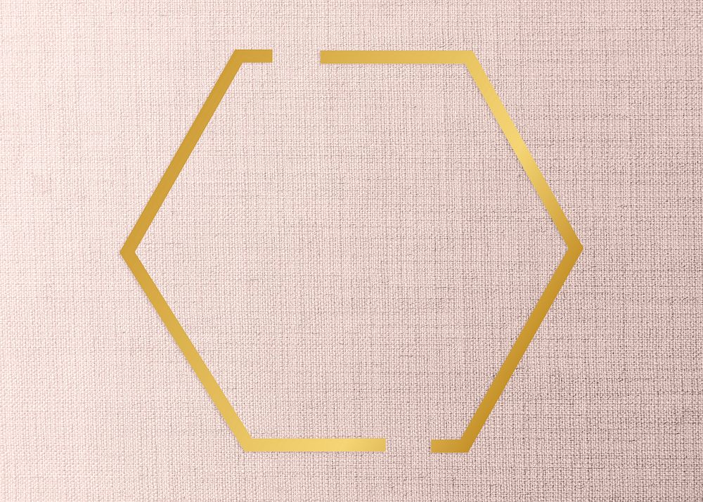 Gold hexagon frame on a peach fabric background