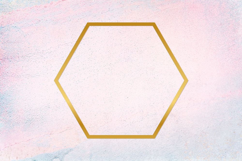 Gold hexagon frame on a pastel concrete background