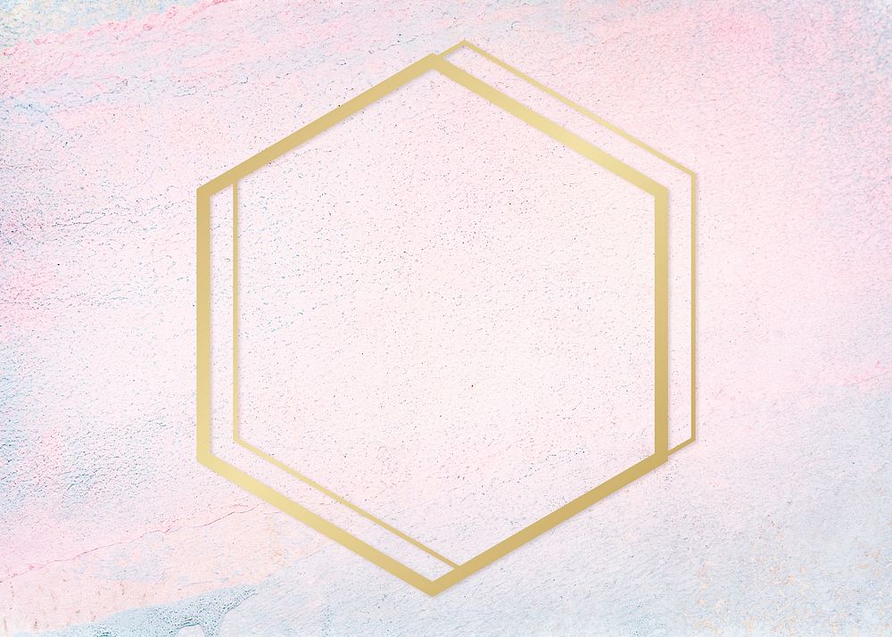 Gold hexagon frame on a pastel concrete background