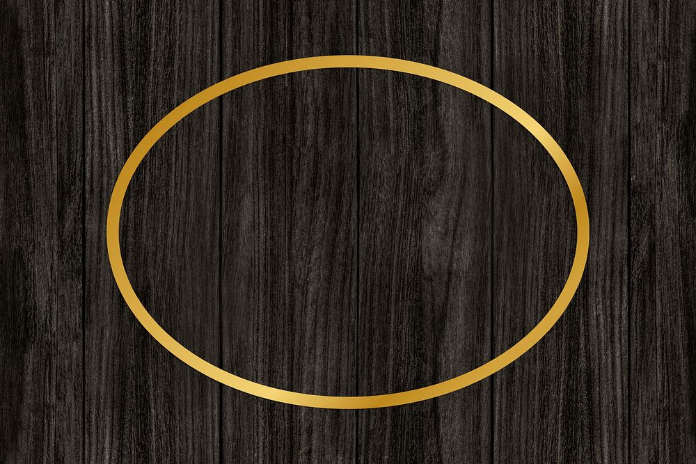 Gold oval frame on a wooden background