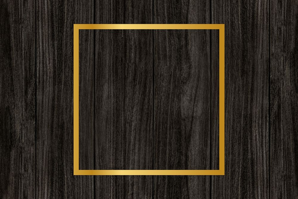 Gold square frame on a wooden background
