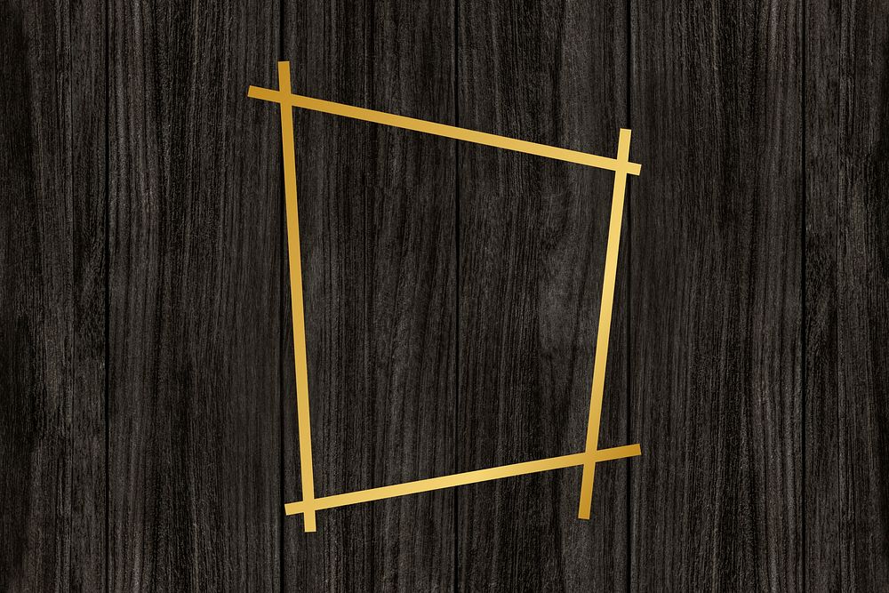 Gold trapezium frame on a wooden background