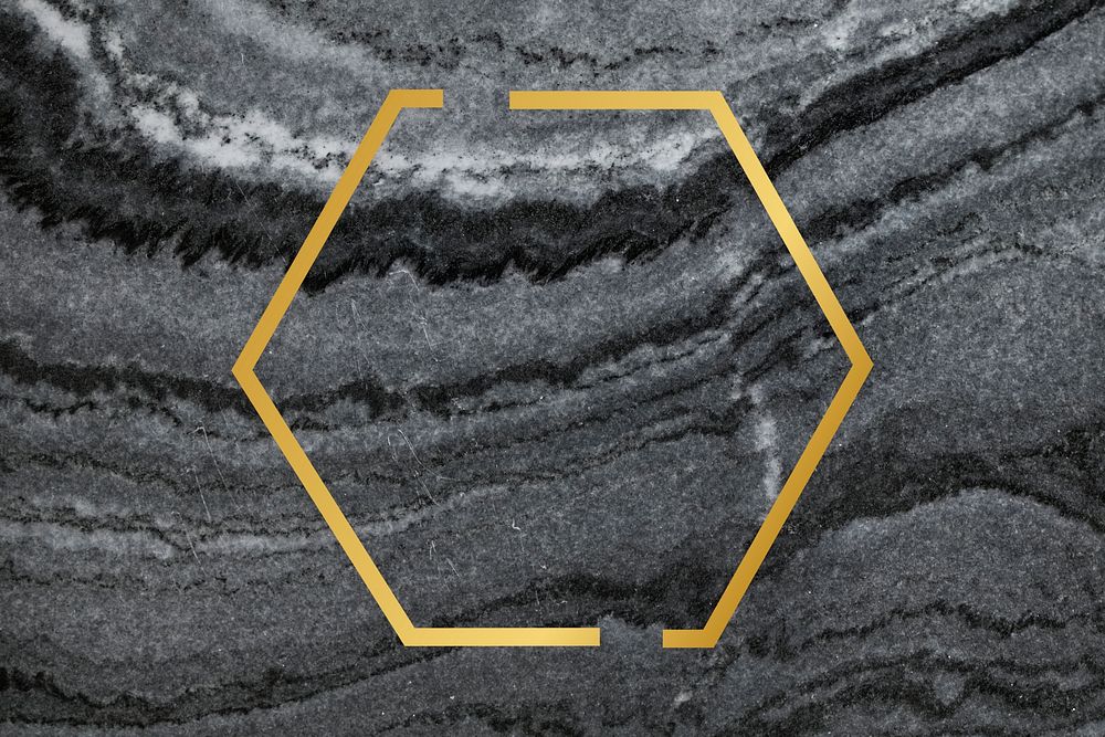 Gold hexagon frame on a gray marble textured background