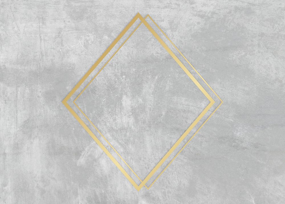 Gold rhombus frame on a gray concrete textured background