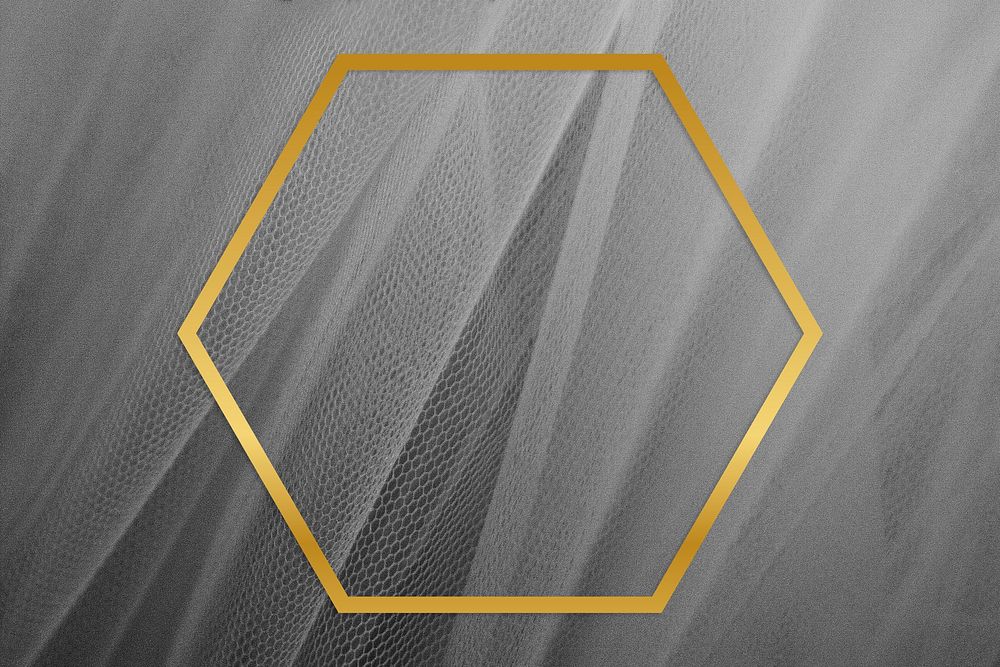 Golden framed hexagon on a gray fabric texture
