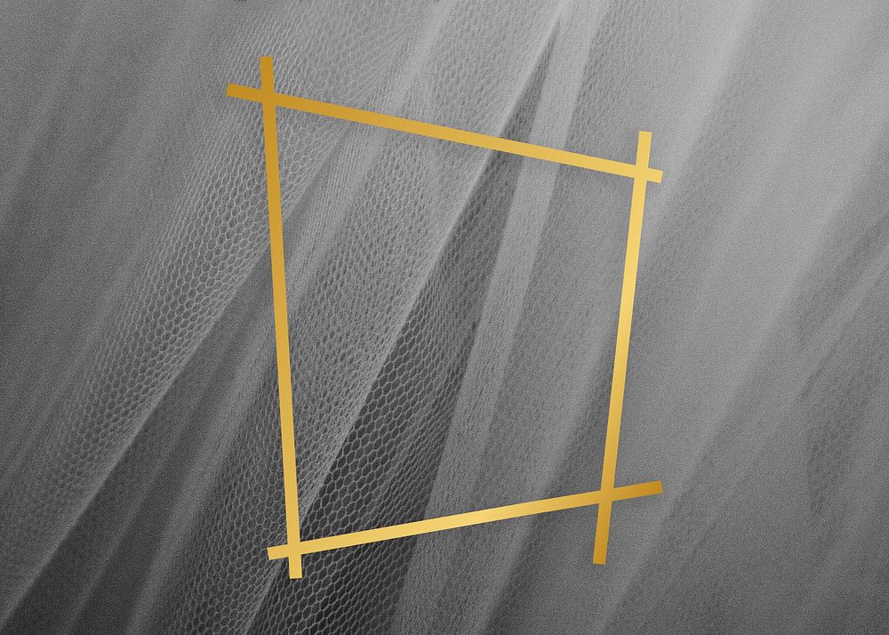 Golden framed trapezium on a gray fabric textur