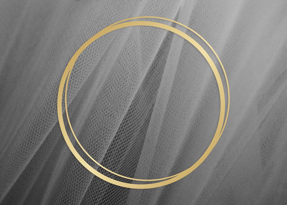 Golden framed circle on a gray fabric texture