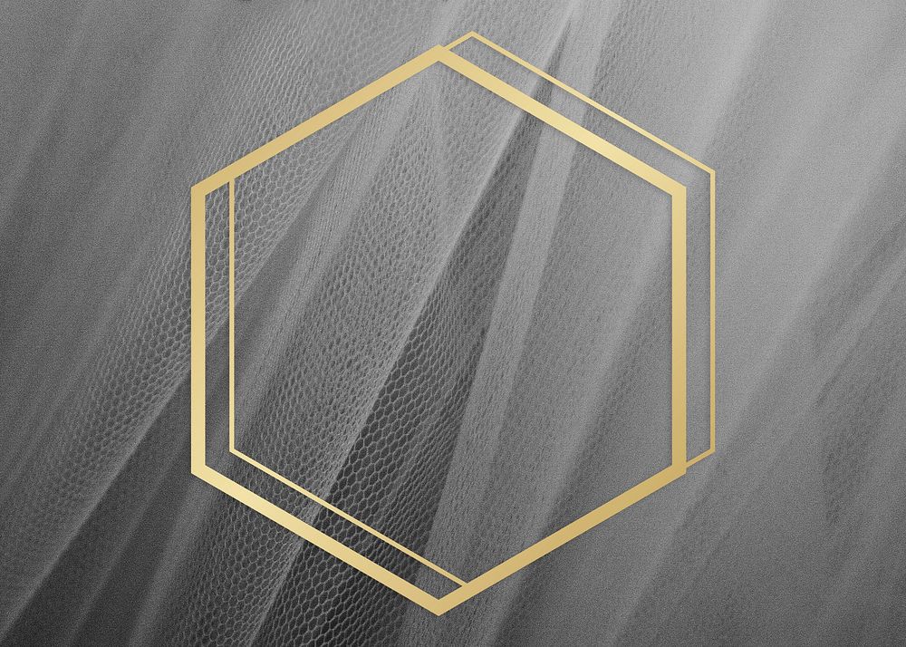 Golden framed hexagon on a gray fabric texture