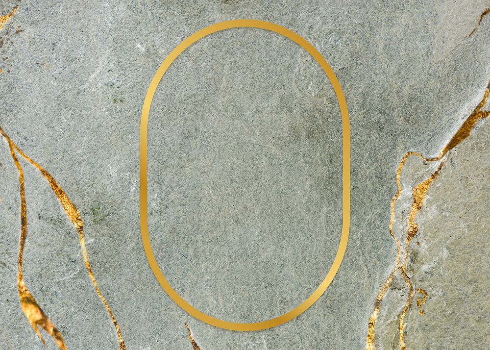 Golden framed oval on a marble texture