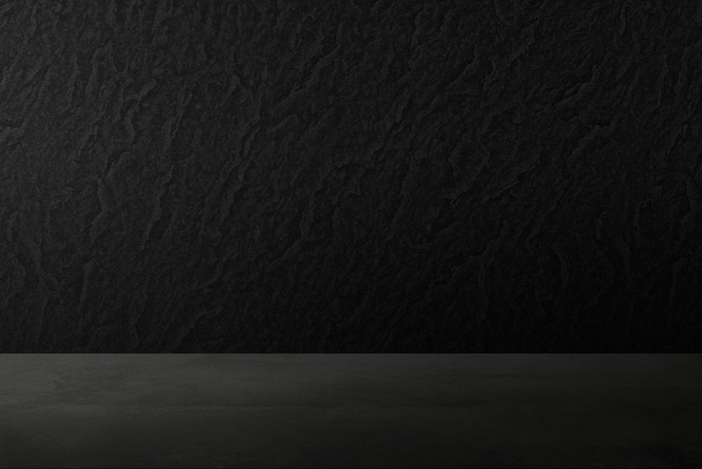 Rough dark black concrete wall product background