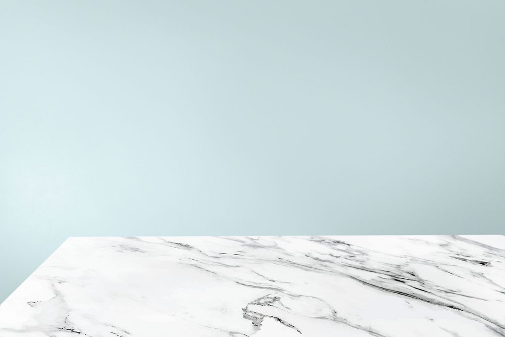 Plain pale blue wall with white marble table product background