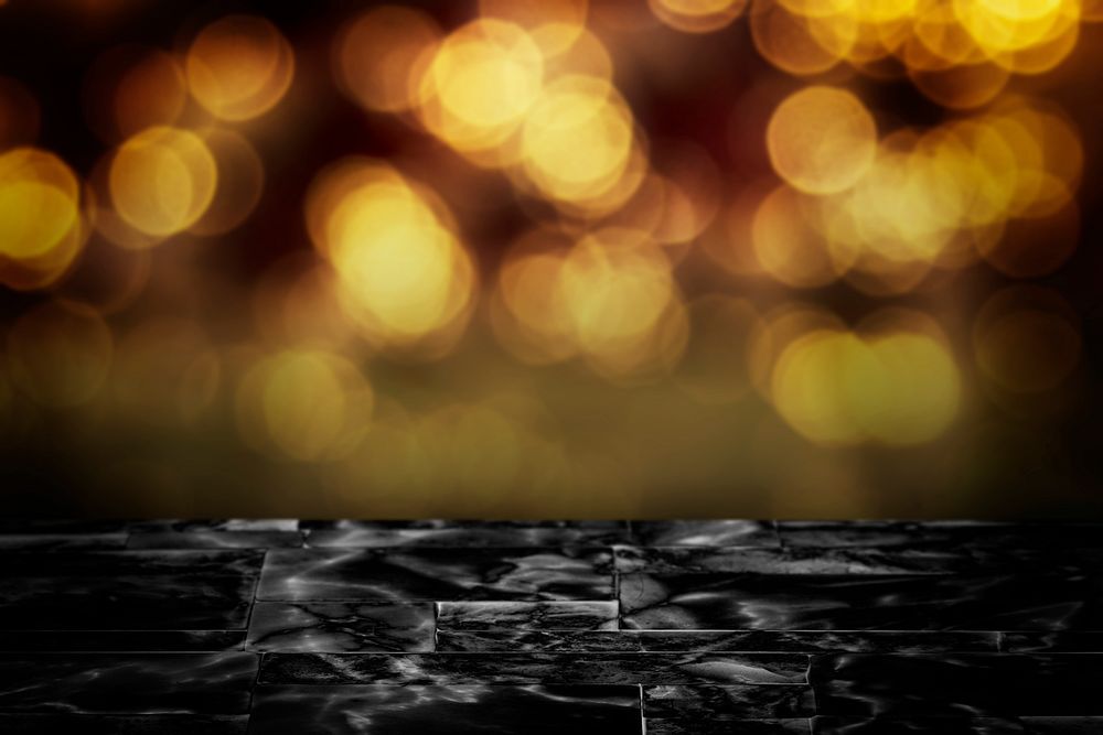 Black marble floor with yellow bokeh light product background