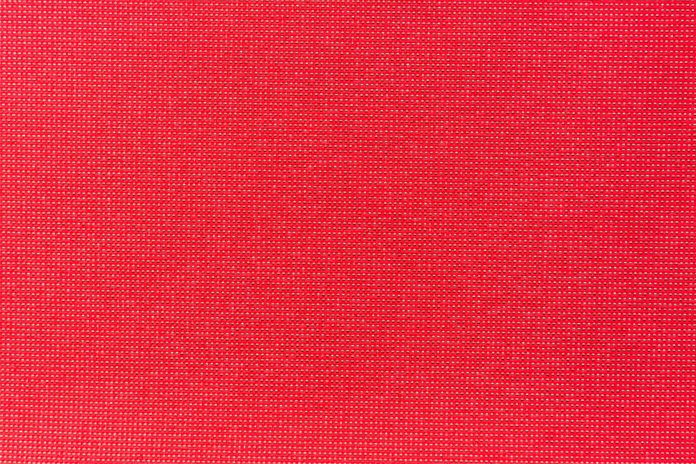 Bright red plain fabric textured background vector