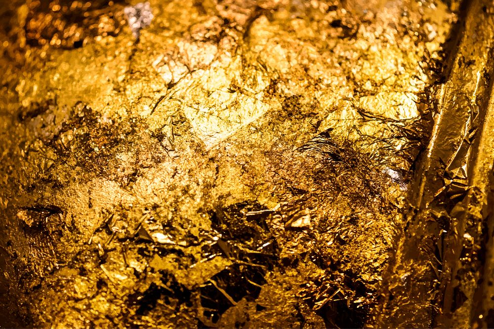 Scraps of gold foil textured background vector