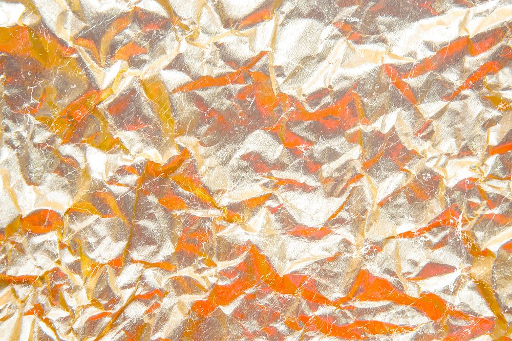 Crumpled gold paper background vector
