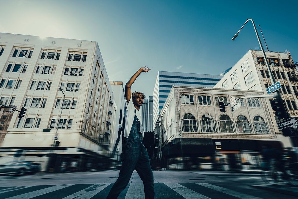 Black man crossing road, urban fashion candid