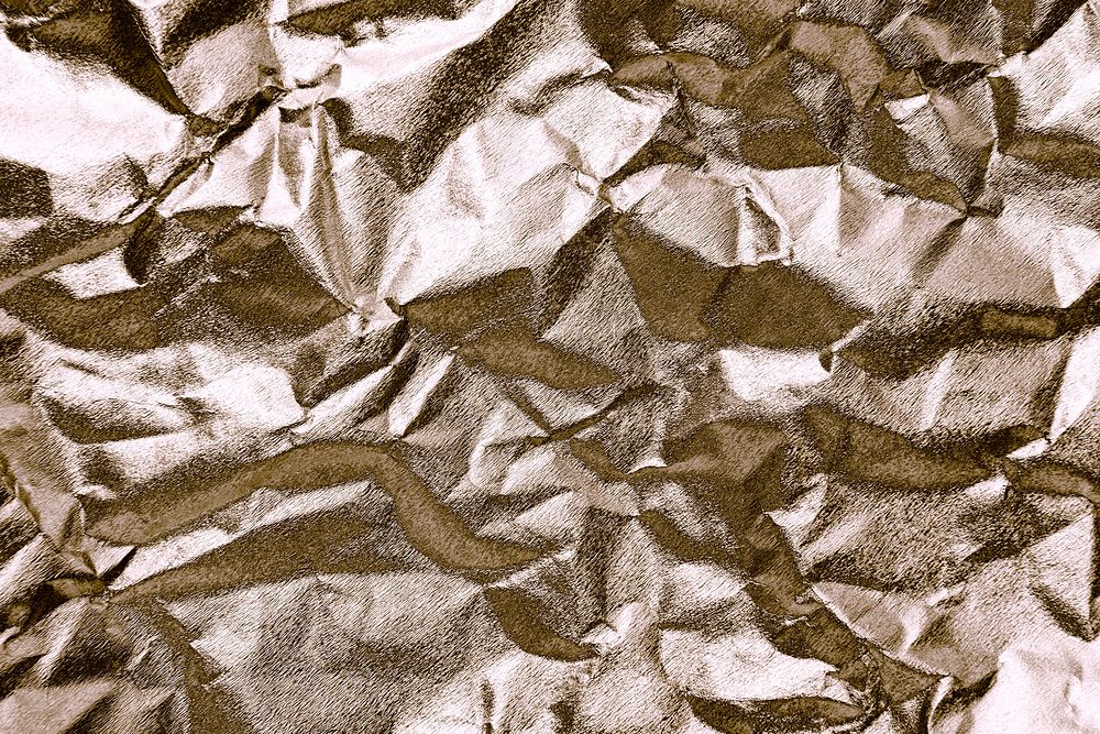 Crumpled gold paper textured background