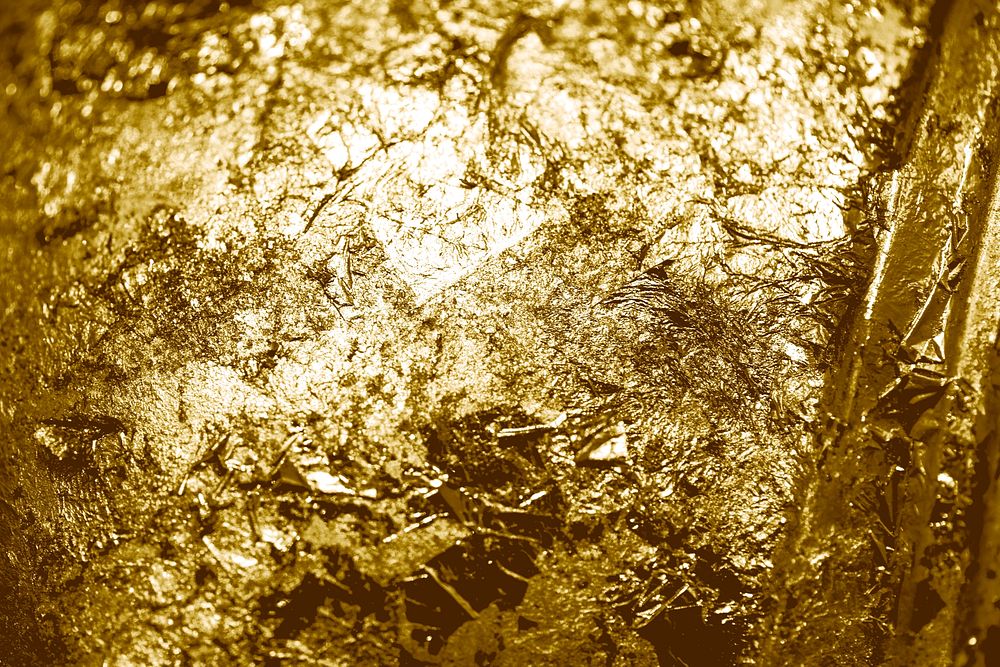 Scraps of gold foil textured background