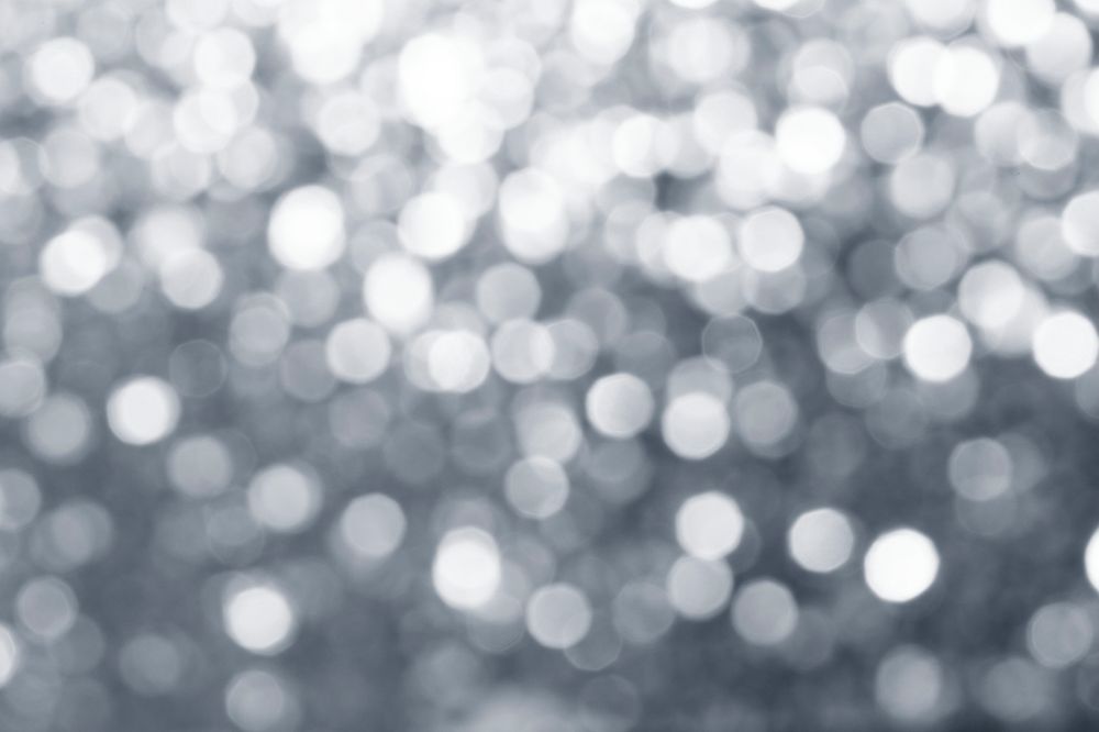 Blurry shiny silver glitter textured background