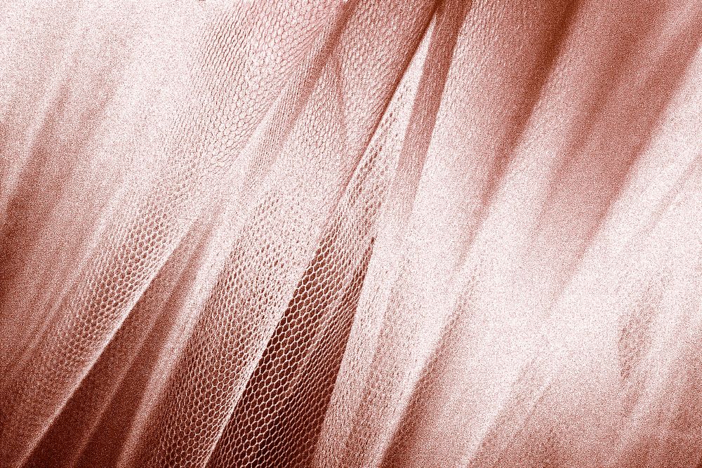 Silky pink gold fabric snakeskin textured background