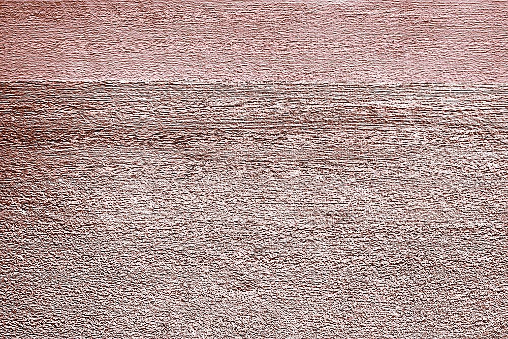 Roughly pink gold painted concrete wall surface background