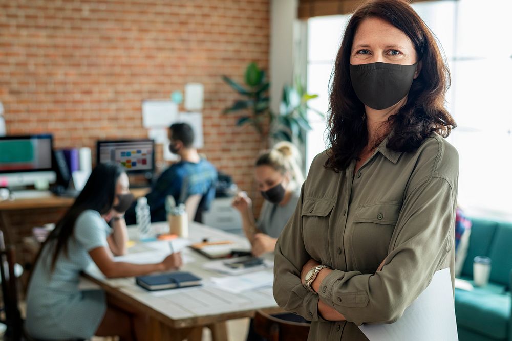 Businesswoman in face mask at the office