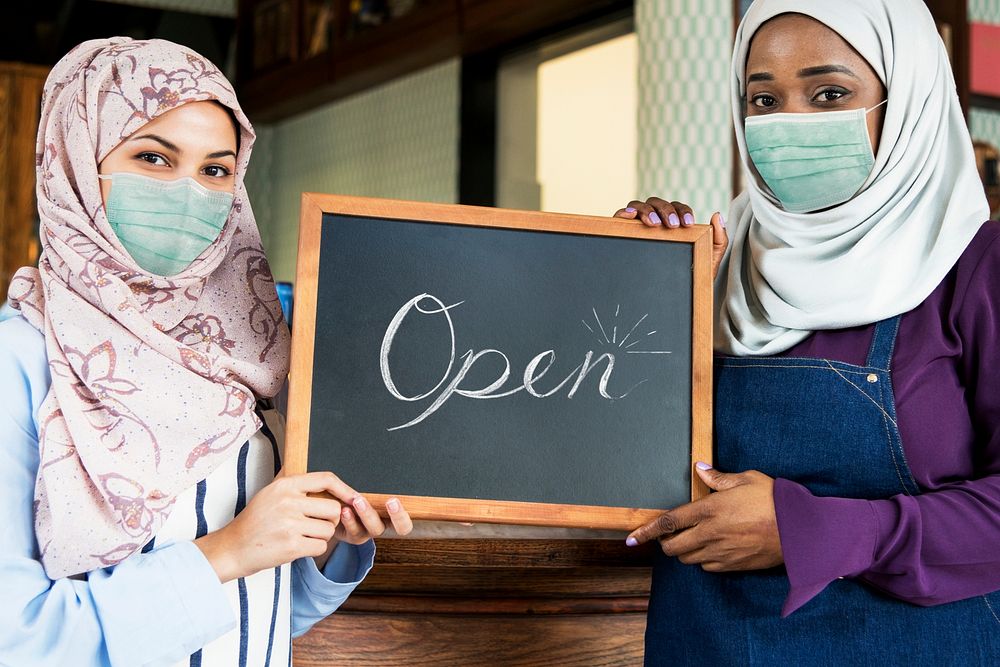 Muslim women in face mask with sign mockup in new normal