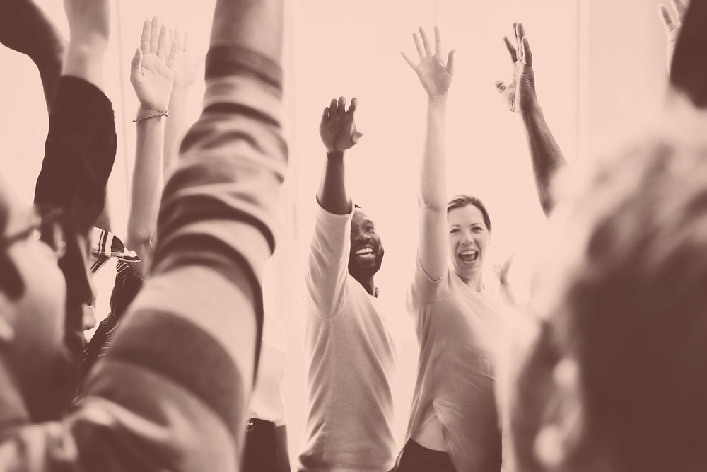 Startup diverse business team hands raised monochrome