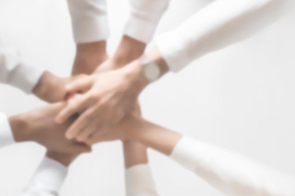 Successful business teamwork joining hands