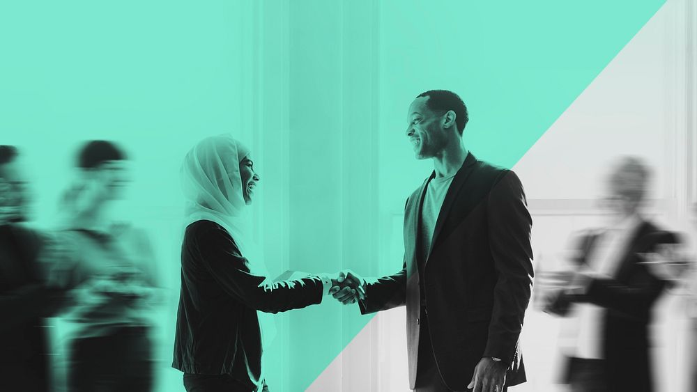 Hijab businesswoman shaking hands green background