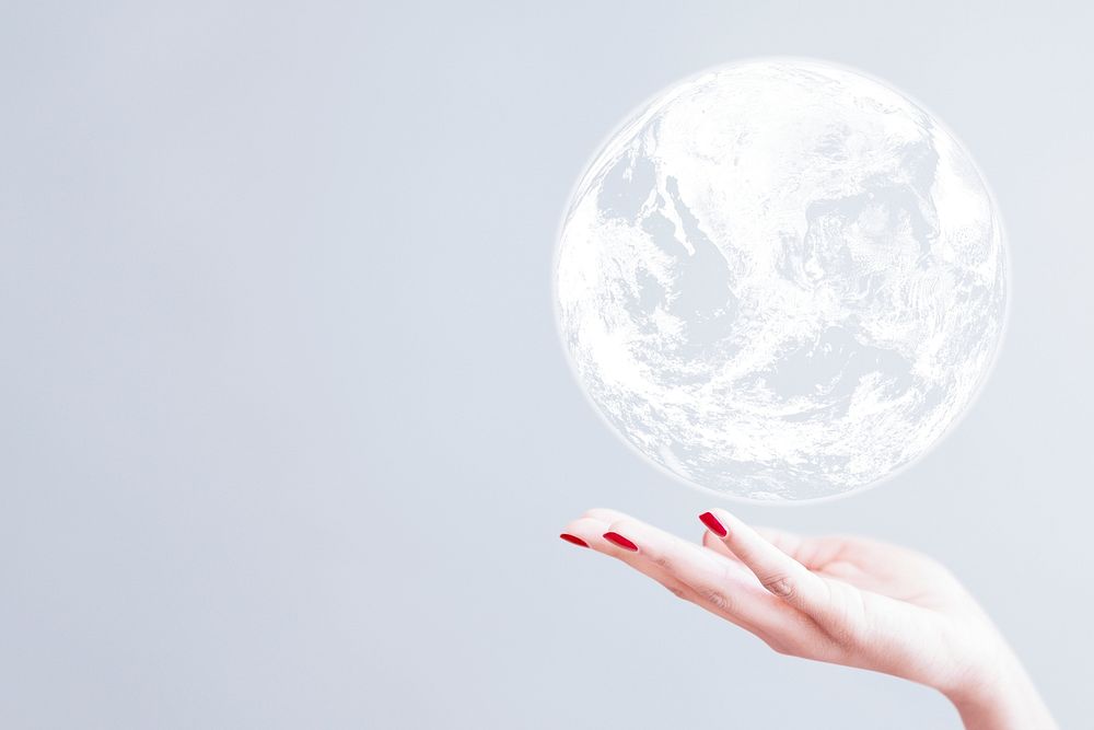 White globe over woman's hand psd gray background