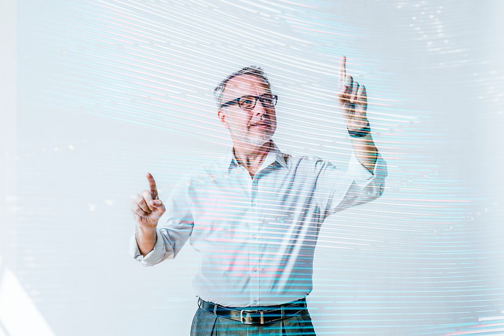 Senior businessman pointing on invisible screen