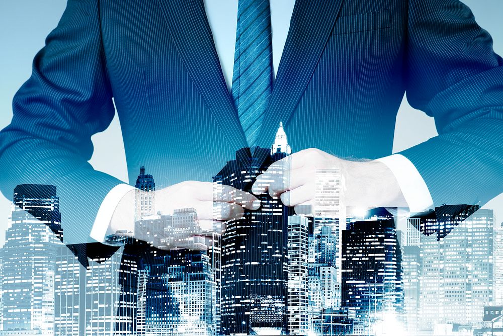 Businessman in suit on city background