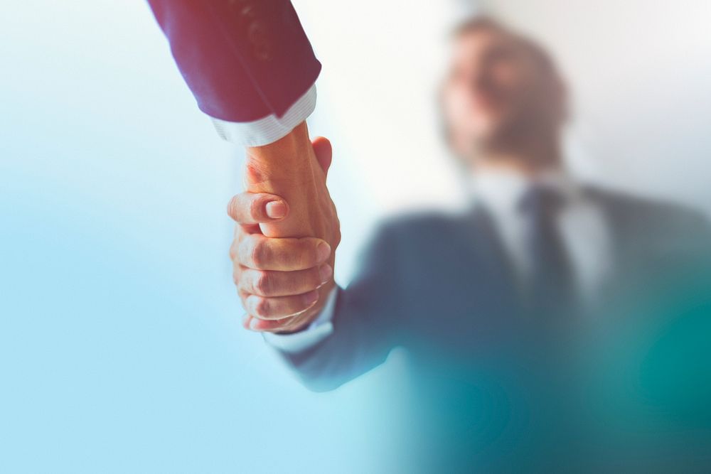 People shaking hands in business agreement