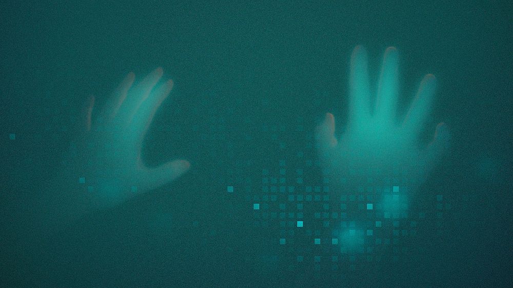 Hands disappearing behind green transparent screen