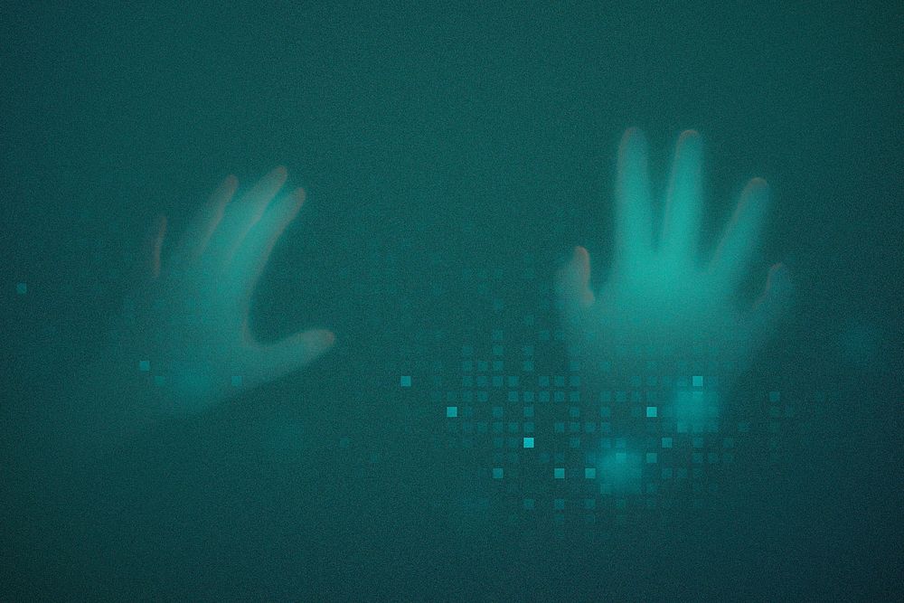 Hands disappearing behind green transparent screen